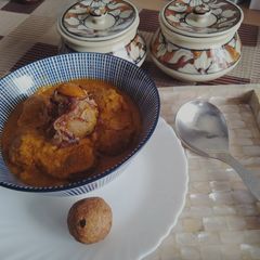 A picture of #BCR#Raw banana kofta in caramelized onion gravy.