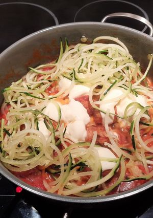 A picture of Zucchini noodles with cheesy meatballs.