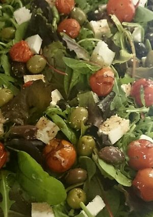 A picture of Roasted cherry tomato, feta and mixed olive salad.