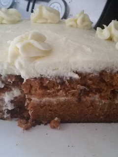 A picture of Carrot Cake with cream cheese frosting.