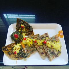 A picture of Paan Paratha with Gulkand Raita.