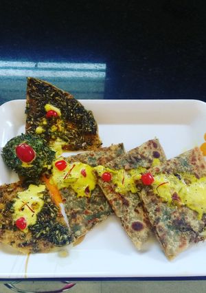 A picture of Paan Paratha with Gulkand Raita.