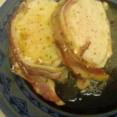 A picture of Bacon wrapped garlic and herb pork loin.