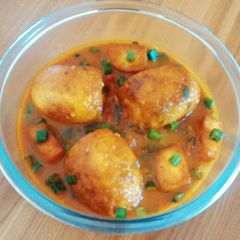 A picture of Egg Curry with Paneer.