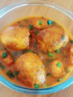 A picture of Egg Curry with Paneer.