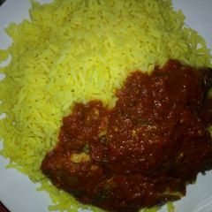 A picture of Green Rice and Stew fish.