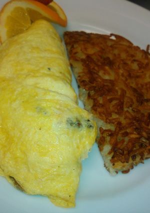 A picture of Mushrooms and onions omelette.