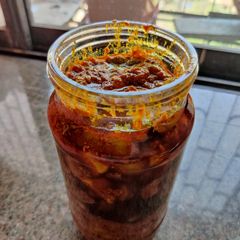 A picture of Raw mango pickle(methiyu).