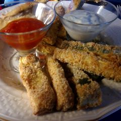 A picture of oven baked zucchini sticks.