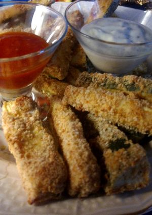 A picture of oven baked zucchini sticks.