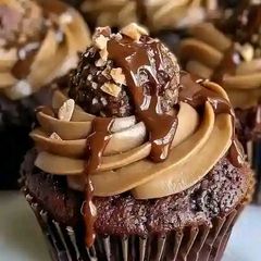 A picture of Luxurious Ferrero Rocher cupcakes 🍫🥜.
