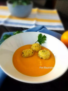 Una foto de Crema de calabaza con mijo y naranja