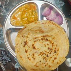 A picture of Kerala Spl Malabar Paratha With Vegetable Moilee.
