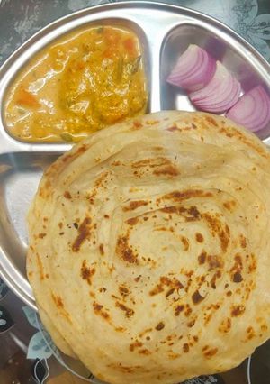 A picture of Kerala Spl Malabar Paratha With Vegetable Moilee.