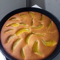 A picture of pie with canned peaches.