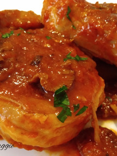 Una foto de Ossobuco con setas