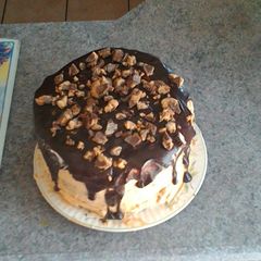 A picture of Chocolate peanut butter cup overload cake.