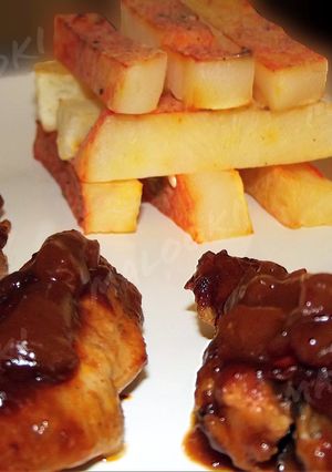 A picture of Sticky barbeque chicken wings with steak potatoes.