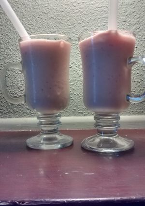 A picture of Pineapple mango peach strawberry smoothie.