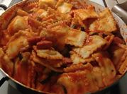A picture of kielbasa and pasta
