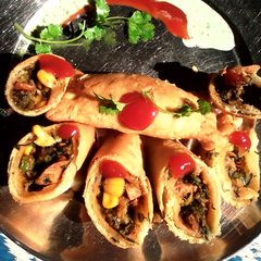 A picture of Spinich & corn rolls,coriender dip.