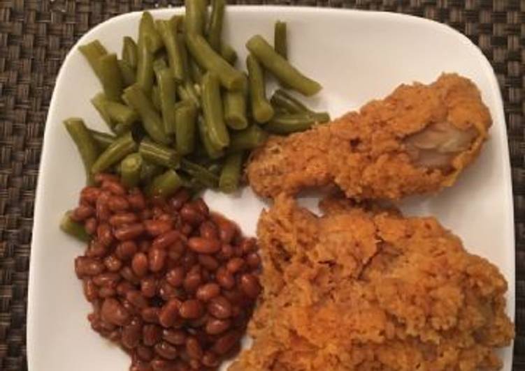 Chicken with green peas and baked beans