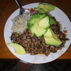Fried white beans served with rice A picture of Fried white beans served with rice.