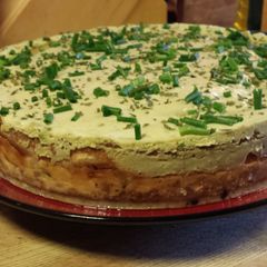 A picture of Smoked Salmon and Blue Cheese Cheesecake with an Avocado Cream Topping.