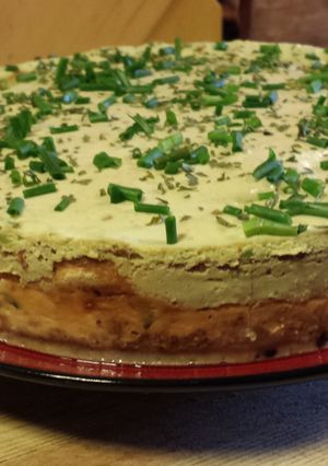 A picture of Smoked Salmon and Blue Cheese Cheesecake with an Avocado Cream Topping.