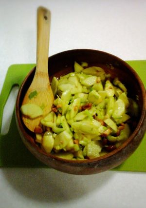 A picture of Green Apple, Celery and Honey roasted Macadamia Nuts with Dijon Mustard dressing.