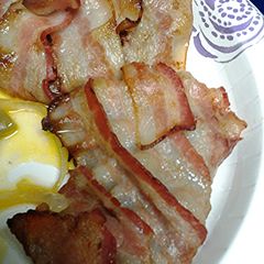 A picture of Bacon wrapped cube steak with hp sauce.