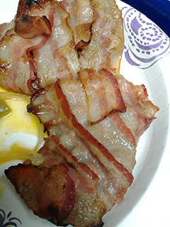 A picture of Bacon wrapped cube steak with hp sauce.