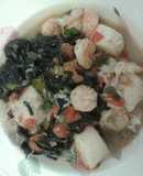 Squid ink pasta with shrimp and scallops.