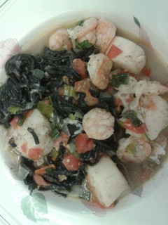 A picture of Squid ink pasta with shrimp and scallops..