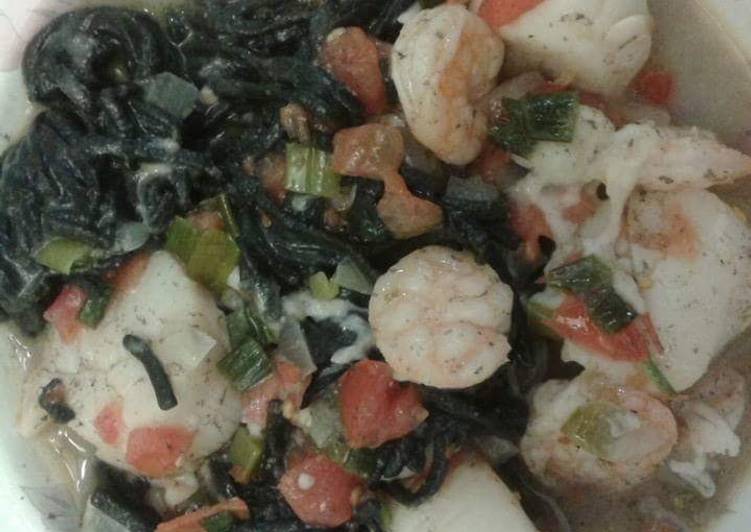 Squid ink pasta with shrimp and scallops.