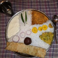 A picture of Rice Sambar Alu Sabji.