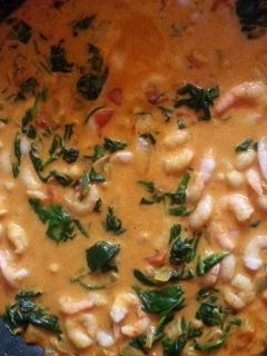 A picture of Prawn and spinach coconut curry.