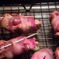 A picture of jalapeno poppers stuffed with lil' smokies.