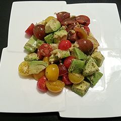 A picture of The Health Salad - Avocado & Tri Color Cherry Tomato Salad.