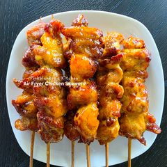 A picture of Air Fryer Chicken Skewers with Bang-Bang sauce.