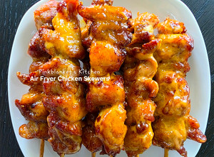 A picture of Air Fryer Chicken Skewers with Bang-Bang sauce.