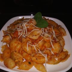 A picture of Conchiglie Pasta in red sauce.