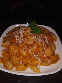 A picture of Conchiglie Pasta in red sauce.