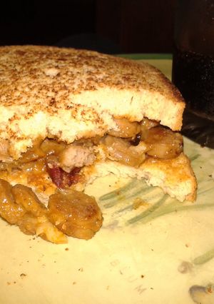 A picture of Sausage and bacon sandwich.