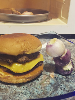 A picture of Double Cheese Burger And Stuffed Baby Onions.