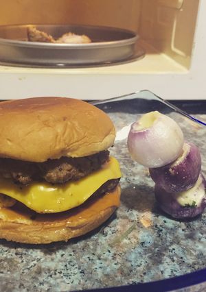 A picture of Double Cheese Burger And Stuffed Baby Onions.