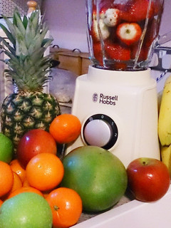 A picture of Banana, pear and strawberry milkshake.