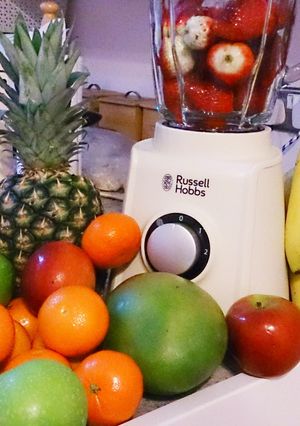 A picture of Banana, pear and strawberry milkshake.