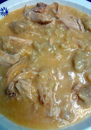 A picture of chicken and homemade dumplings.