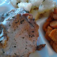 A picture of Extreme Butter Garlic Baked Pork Chops with Potatoes.